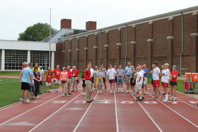 a group of people standing on a track