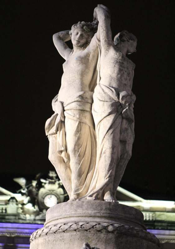 a statue of two women