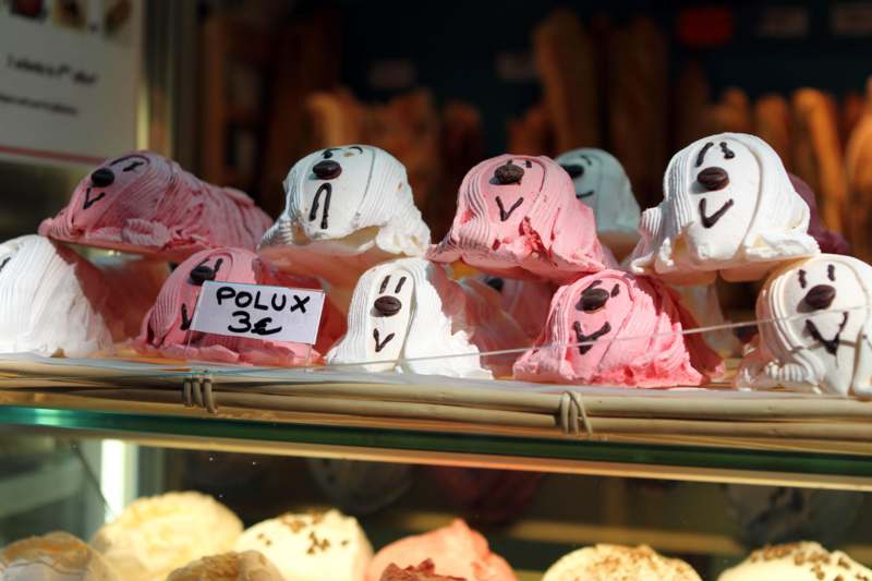 a display case with ice cream shaped like faces