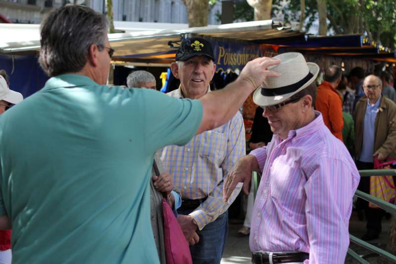 a man touching a hat