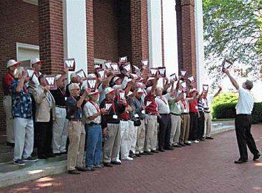 a group of people holding up signs