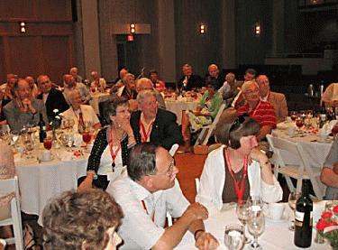 a group of people sitting at tables