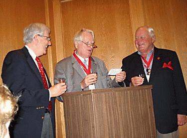 a group of men standing at a podium