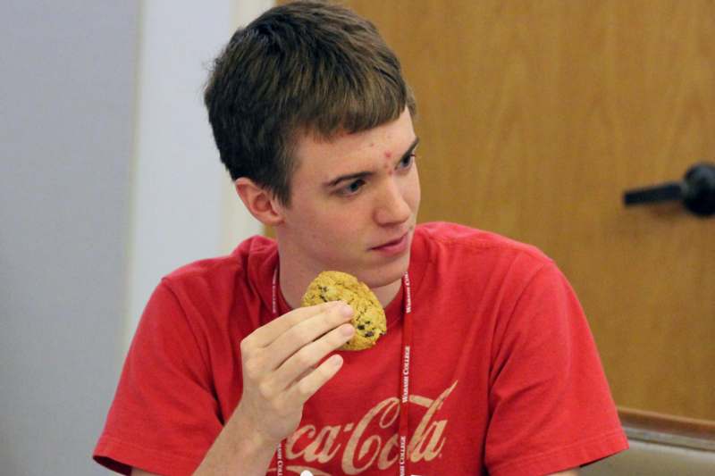 a man eating a cookie