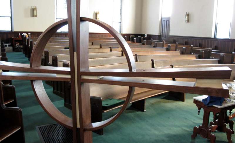 a wooden bench in a church