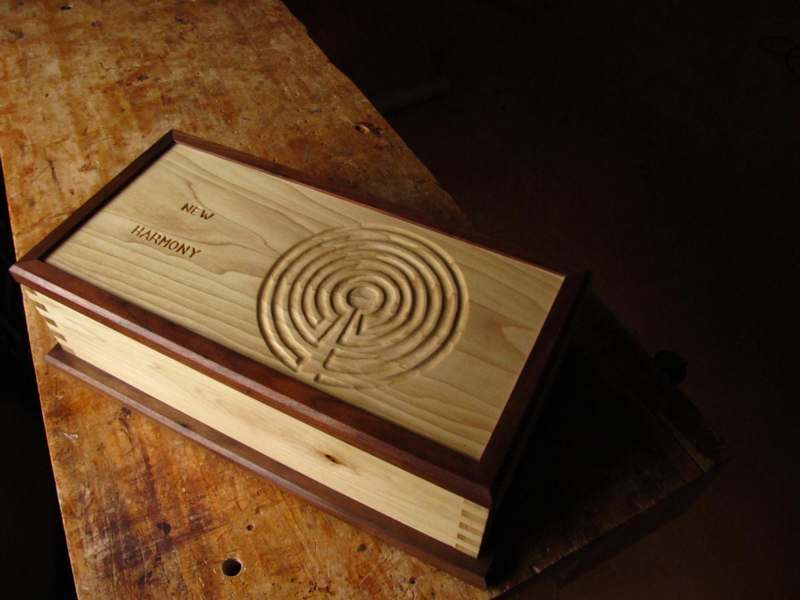 a wooden box with a carved design