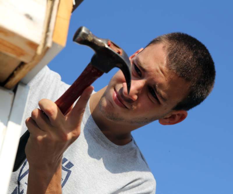 a man holding a hammer