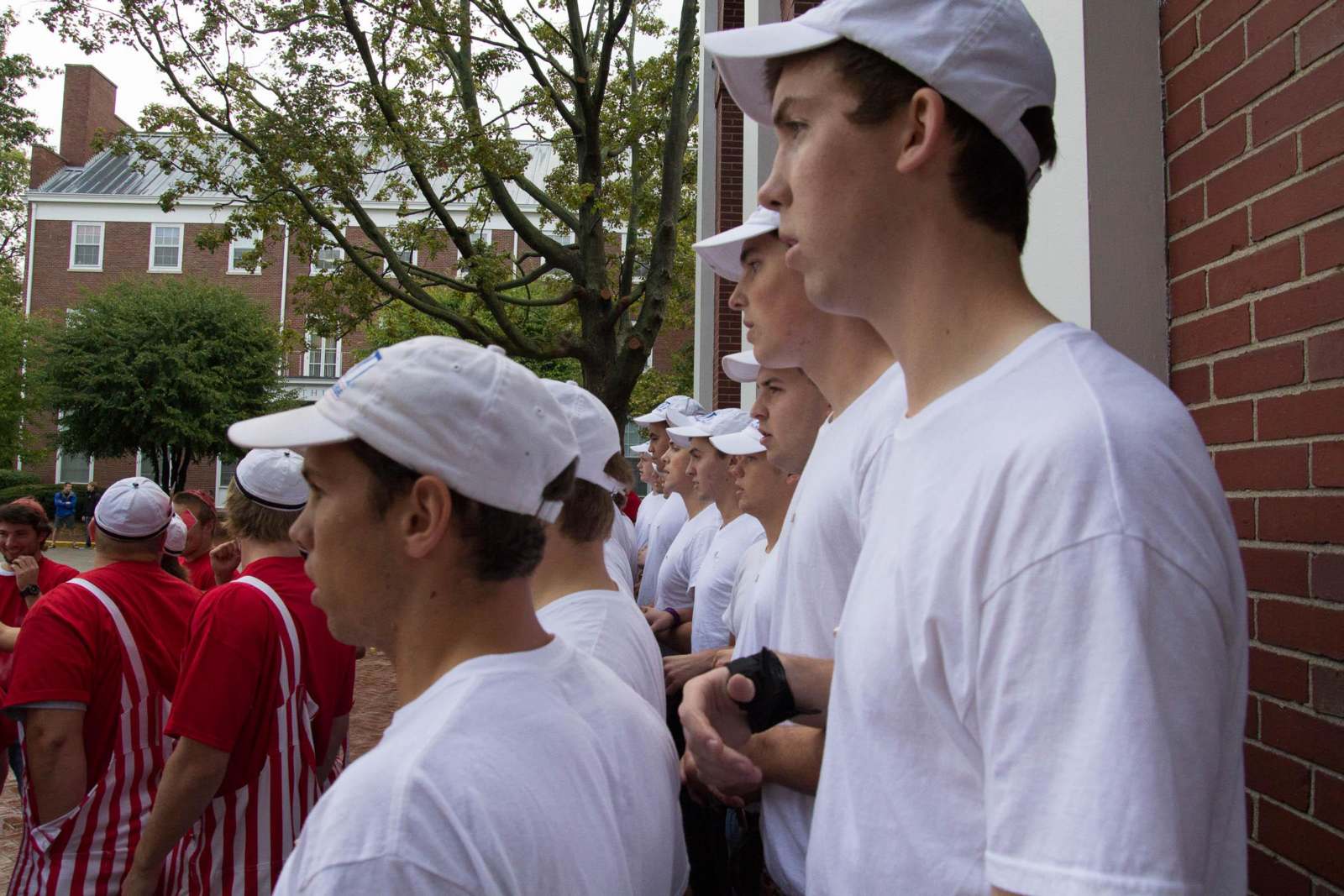 a group of people in white shirts