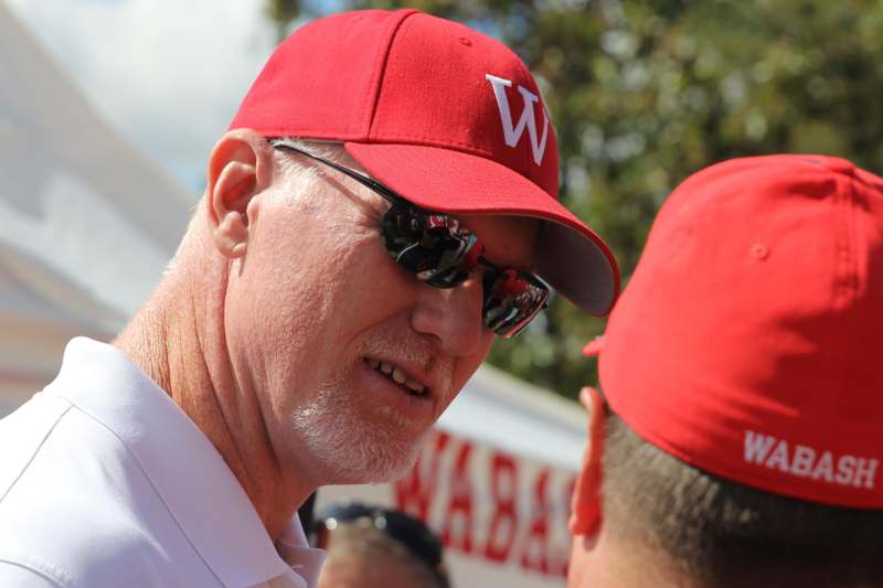 a man wearing a red hat and sunglasses