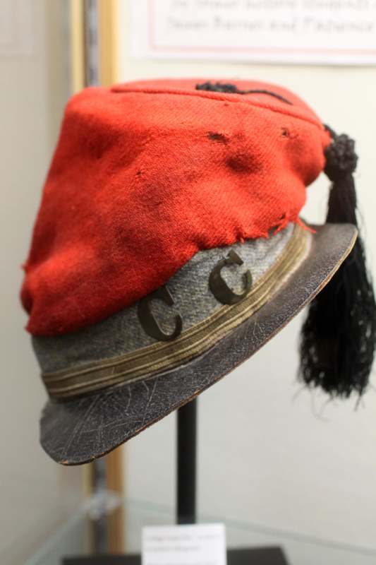 a red hat with a tassel