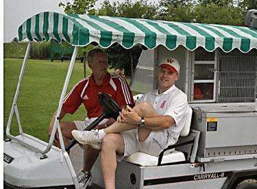 a man sitting in a golf cart