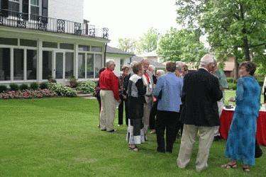 a group of people standing in a yard