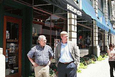 men standing outside a store