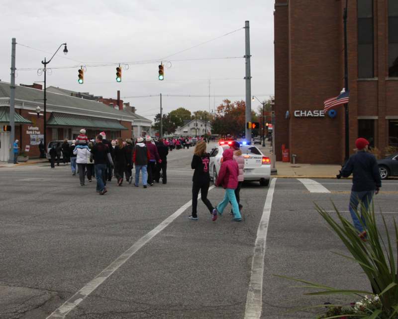 a group of people walking in a street