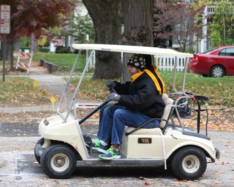 a person driving a golf cart