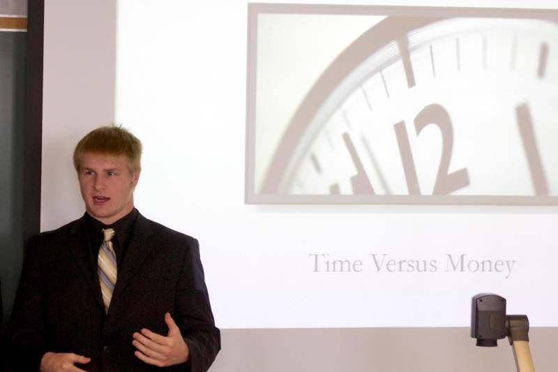 a man in a suit giving a presentation