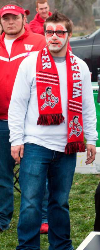 a man wearing a red scarf