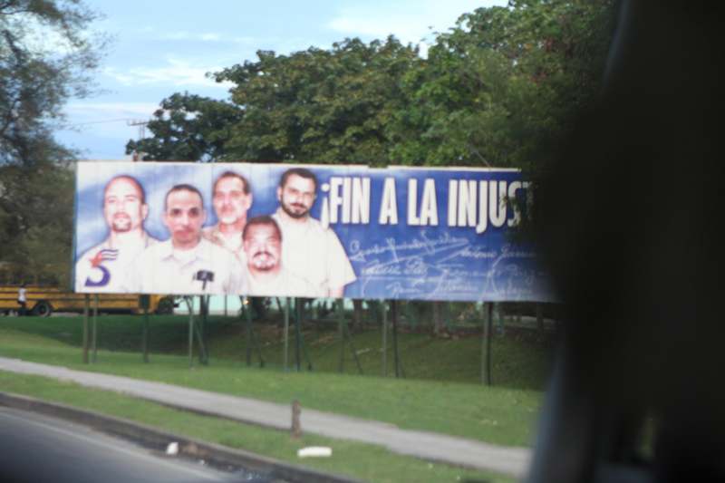 a billboard with a group of men on it