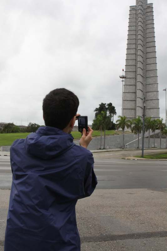 a person taking a picture of a tower