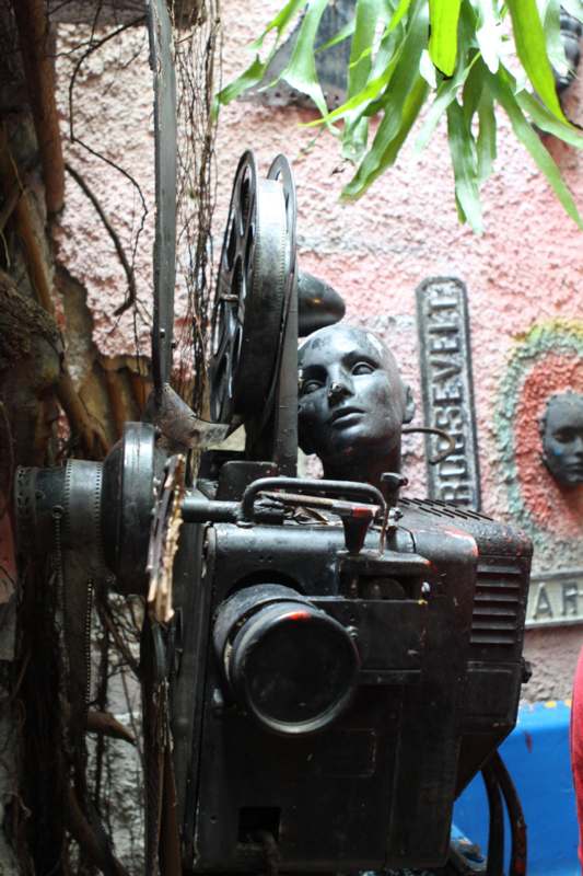 a statue of a man's head on a movie projector