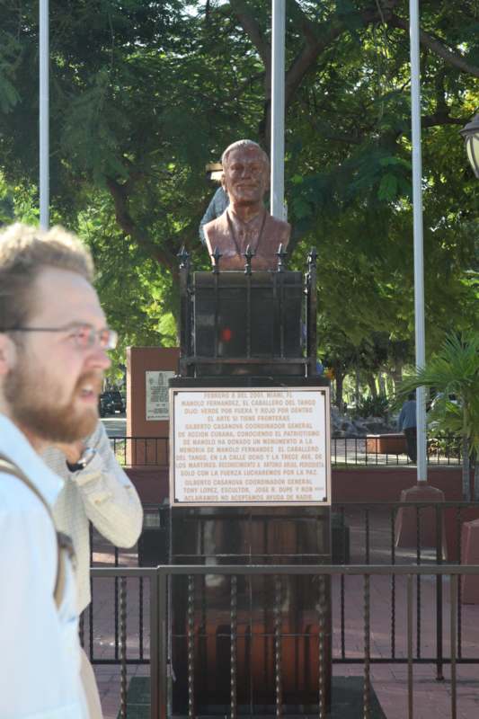 a man looking at a statue