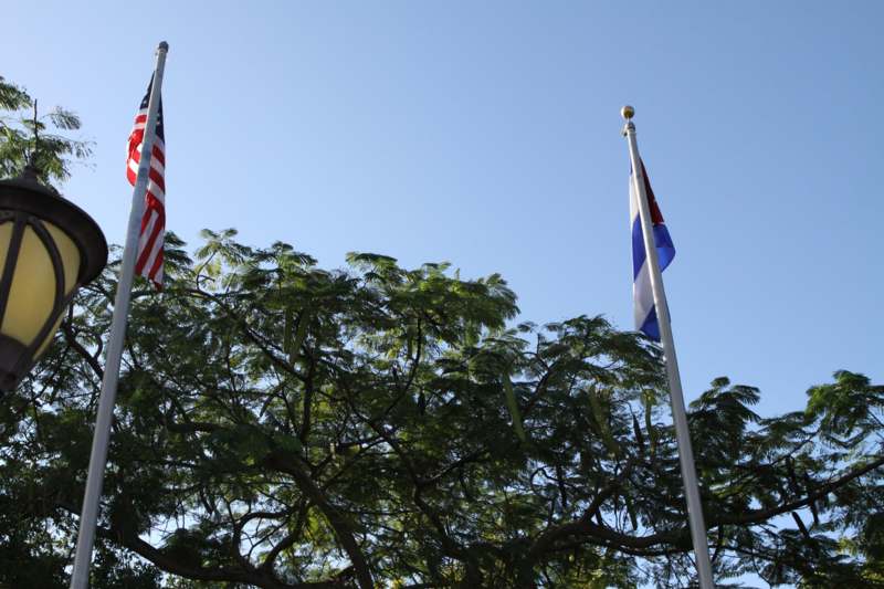 a flagpoles with flags on top of each other