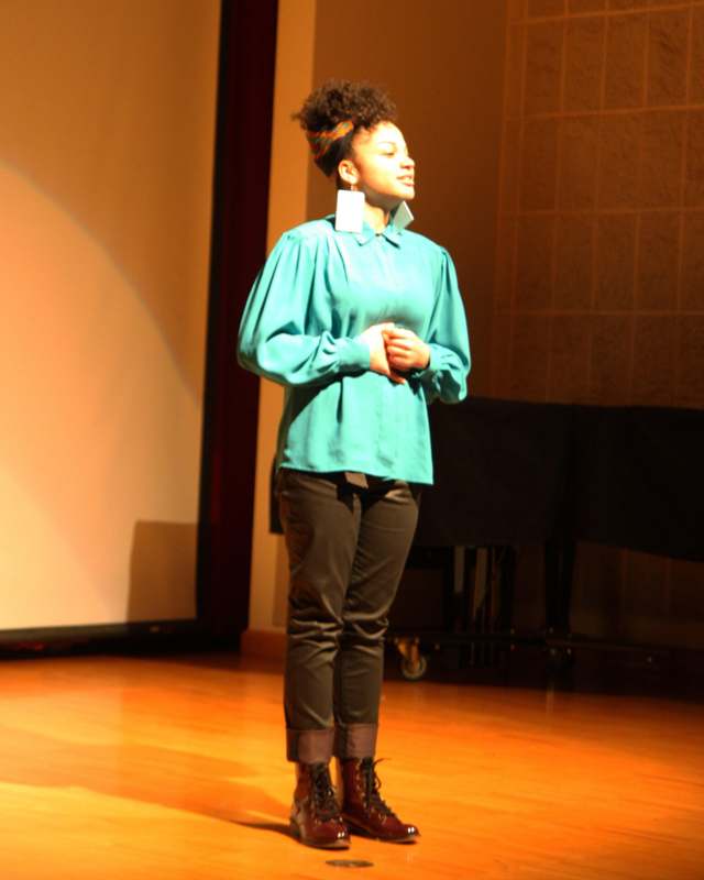 a woman standing on a stage