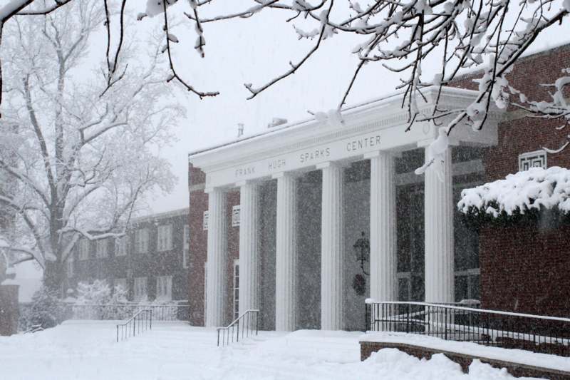 a building with columns and snow