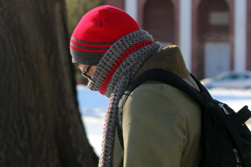 a person wearing a red hat and scarf
