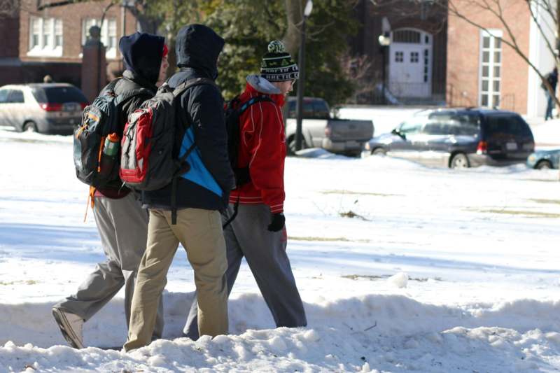 a group of people walking in the snow