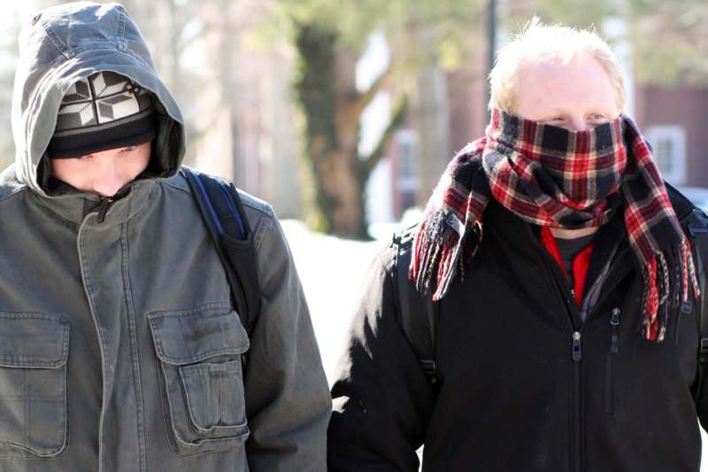 two men wearing winter clothes