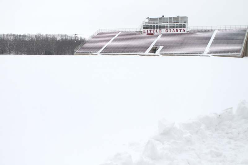 a stadium with snow on the ground