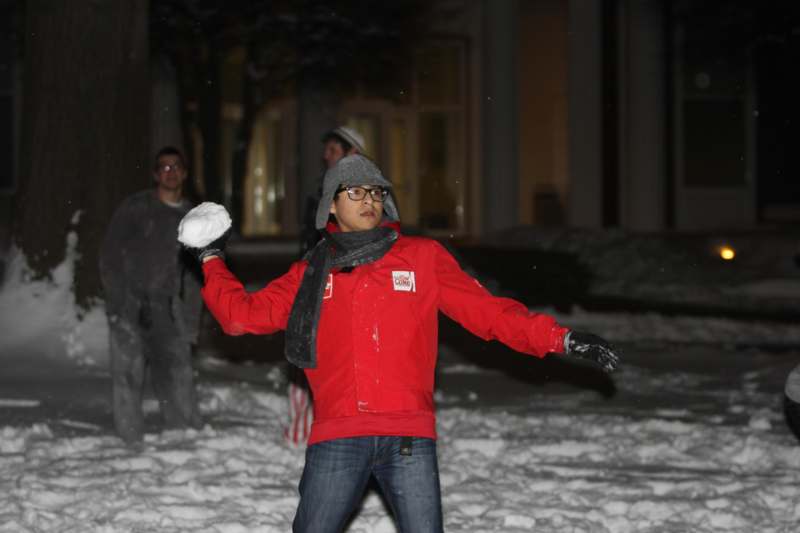 a man throwing a snowball