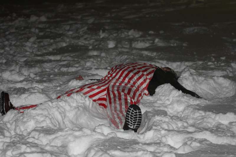a person lying in snow