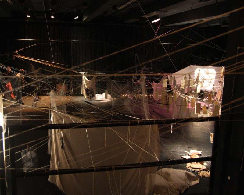 a stage with white cloths and clothespins