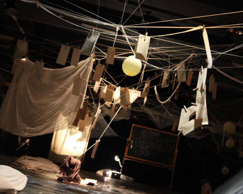a stage with paper and string