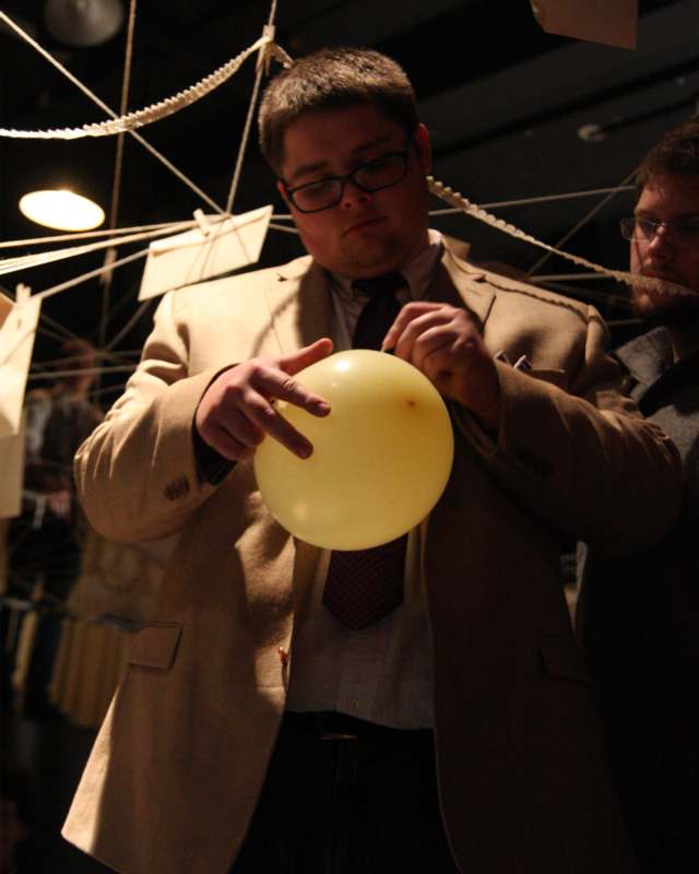 a man holding a yellow balloon