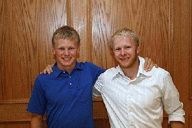 a couple of men posing for a picture