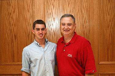 a man and a young man standing together