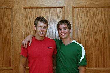 a couple of men standing in front of a door