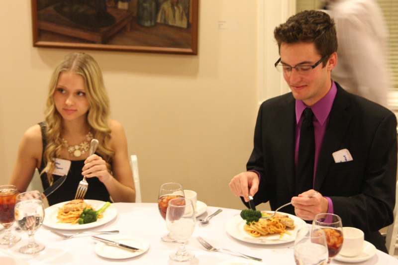 a man and woman eating at a table