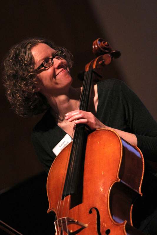 a woman playing a cello