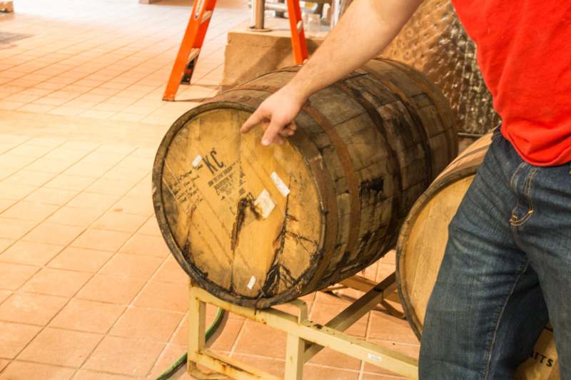 a man holding a barrel