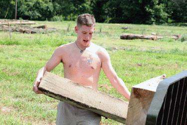 a man carrying a wood beam