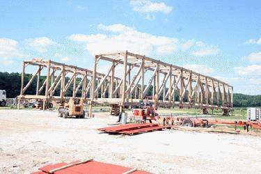 a construction site with a large wooden structure