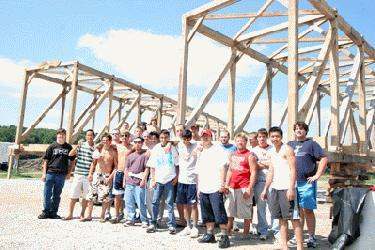 a group of people standing in front of a structure