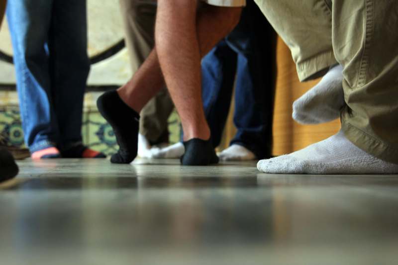 a group of people's feet in socks