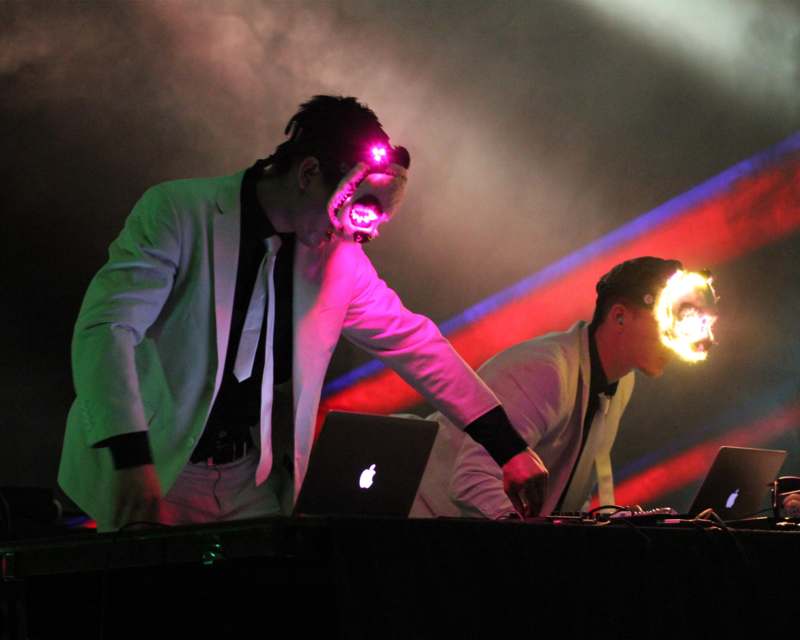 two men with glowing lights on their faces