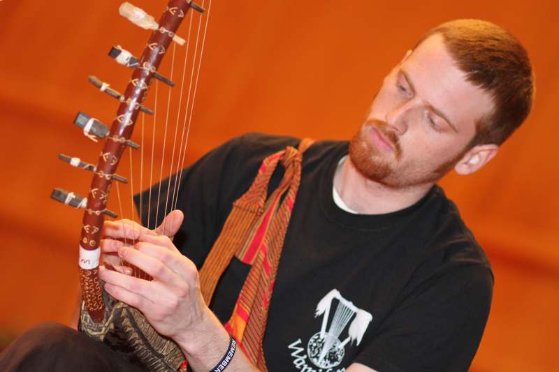 a man playing a stringed instrument