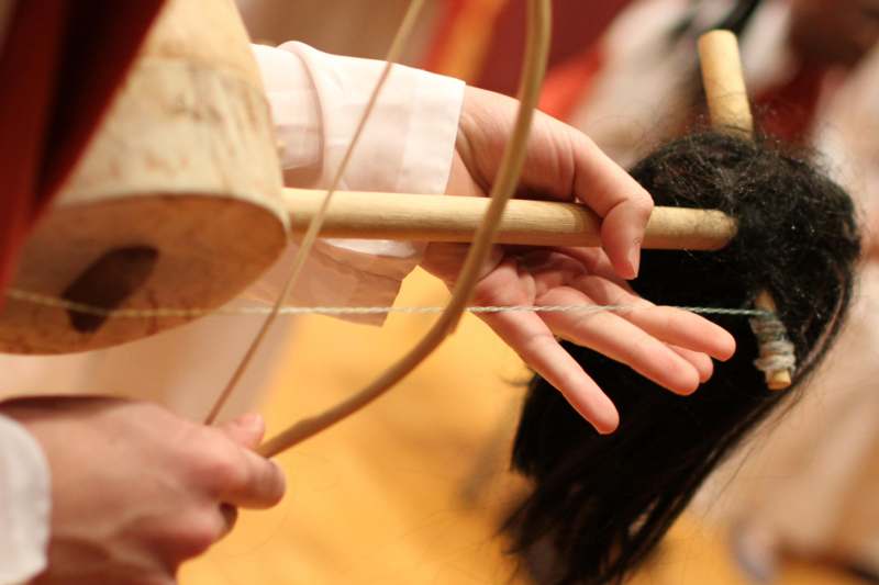 a person using a wood loom